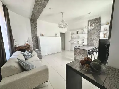 a living room with a couch and a table at Domus Symmetrie in Rome