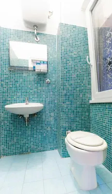 a bathroom with a toilet and a sink at Casa Emiliani Ospedale San Camillo - Cale 09 in Rome