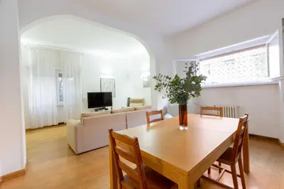 a living room with a table and a couch at Casa Emiliani Ospedale San Camillo - Cale 09 in Rome