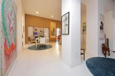 a living room with a large painting on the wall at Beautiful Monti apartment Panisperna in Rome