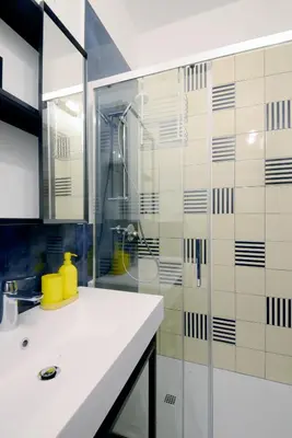a bathroom with a shower and a white sink at Led House Roma in Rome