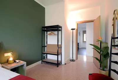 a room with a closet with a mirror in it at Led House Roma in Rome