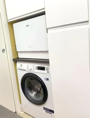 a washer and dryer in a kitchen with a microwave at Monti Lovely Suite in Rome