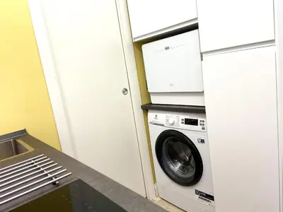 a laundry room with a washing machine and a sink at Monti Lovely Suite in Rome