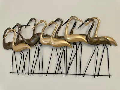 a group of metal flamingos hanging on a wall at Monti Tiburtini Roma Guest House Apartment in Rome