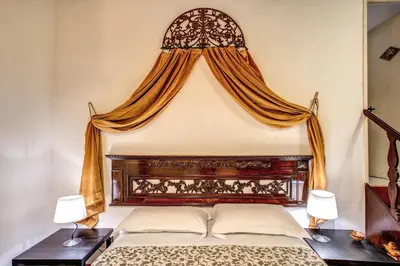 a bedroom with a large bed with a window at Home-In-Rome in Rome