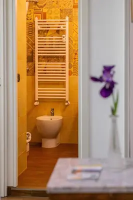 a bathroom with a sink and a toilet in a room at Home relax San Lorenzo in Rome