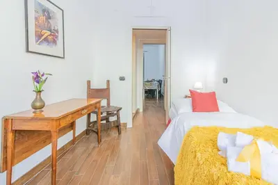a bedroom with a desk and a bed and a desk at Home relax San Lorenzo in Rome