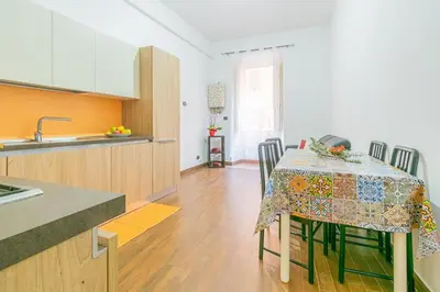 a kitchen with a table with a table cloth on it at Home relax San Lorenzo in Rome
