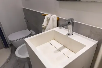 a bathroom with a white sink and a toilet at Br1tannia 36 in Rome