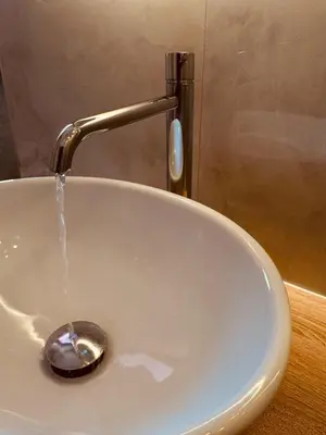a sink with water coming out of a faucet at Casa Umbertina in Rome