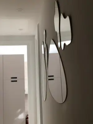 a mirror hanging on a wall in a bathroom at Casa Umbertina in Rome
