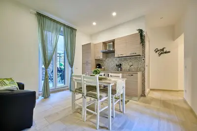 a kitchen with a table and chairs in a room at SweetgardenTrastevere in Rome