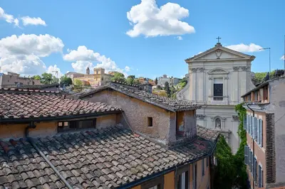 a view of roofs of buildings in a city at SweetgardenTrastevere in Rome