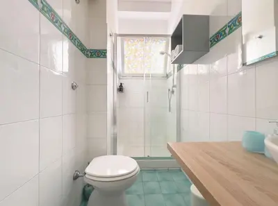 a bathroom with a toilet and a shower at Vintage Charm & Comfort - Garbatella in Rome