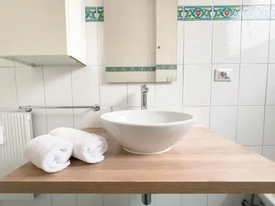 a bathroom with a sink and towels on a counter at Vintage Charm & Comfort - Garbatella in Rome