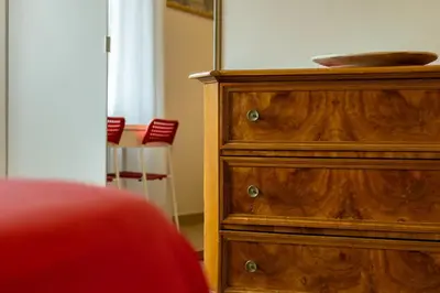 a wooden dresser with a bowl on top of it at kis inn affitacamere guesthouse in Rome