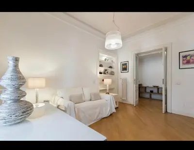 a white living room with a couch and a table at Rome Luxury House 5stars in Rome