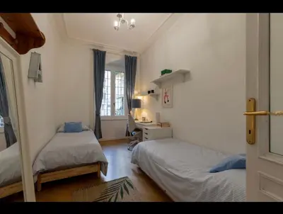a bedroom with two beds and a desk in it at Rome Luxury House 5stars in Rome