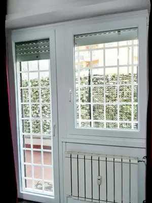 a small bedroom with a bed and a dresser at Lovely flat next to vatican - private entrance in Rome