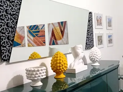 a display of vases on a glass table in a museum at BIBI San Giovanni Roma in Rome