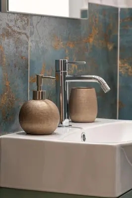 a sink with a faucet and a soap dispenser on it at MADI Collection Colosseum in Rome