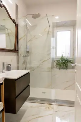 a bathroom with a shower and a sink at MADI Collection Colosseum in Rome