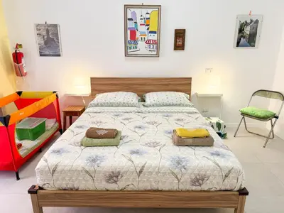 a bedroom with a bed with two pillows on it at Nuovo monolocale a 15 minuti dalla Stazione Termini in Rome