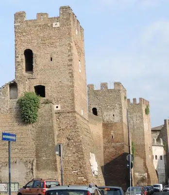a large castle with cars parked in front of it at Nuovo monolocale a 15 minuti dalla Stazione Termini in Rome