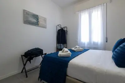 a bedroom with a bed with two towels on it at Roma 2 minuti a piedi dal Vaticano in Rome