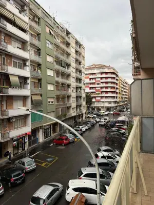 a view of a parking lot with cars parked at Roiti House Holiday - Roma da Vivere in Rome