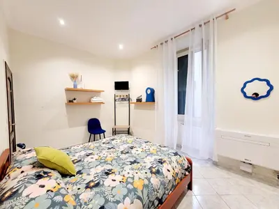 a bedroom with a bed and a window at House 5 minutes walk from Vatican Museums in Rome