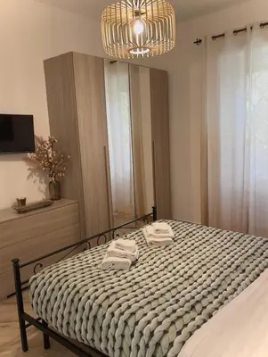 a bedroom with a bed with two towels on it at La casa di Tilde Roma POLDO in Rome