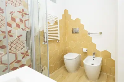 a bathroom with a toilet and a sink and a shower at Casa Libetta in Rome