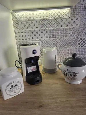 a counter with a coffee maker and a coffee pot at Casa Libetta in Rome