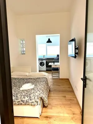 a bedroom with a bed and a window with a piano at Posto del Cuore in Rome