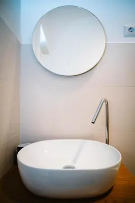 a bathroom with a white sink and a mirror at Posto del Cuore in Rome