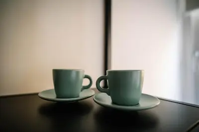 two coffee cups sitting on top of a table at Posto del Cuore in Rome