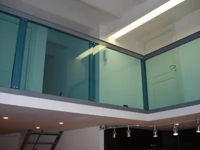 a large glass wall in a room with lights at Loft in old town near Termini Station and University in Rome