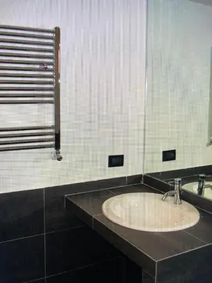a bathroom with a sink and a mirror at Loft in old town near Termini Station and University in Rome