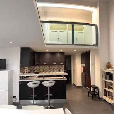 a kitchen with a large skylight in the ceiling at Loft in old town near Termini Station and University in Rome