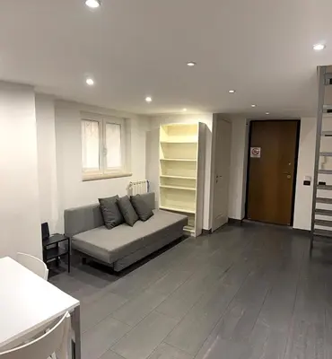 a living room with a couch in the middle at Loft in old town near Termini Station and University in Rome
