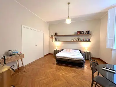 a bedroom with a bed and a desk and a table at Marbel's Rooms in Rome