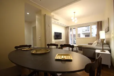 a living room with a table and a couch at Contessa 3BR Holiday House in Rome