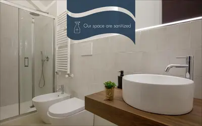 a bathroom with a tub and a sink and a toilet at Daplace - Costanza Apartment in Rome