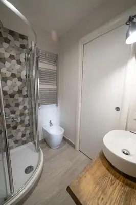 a bathroom with a shower and a sink and a toilet at Loft Aurelia 336 in Rome