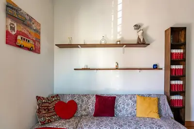 a living room with a couch with pillows on it at Center Suite Garbatella in Rome