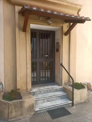 a front door of a building with stairs and a door at Center Suite Garbatella in Rome