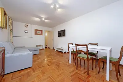 a living room with a table and chairs and a couch at Pantheon Apartment Rondanini in Rome