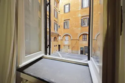 an open window with a view of a building at Pantheon Apartment Rondanini in Rome